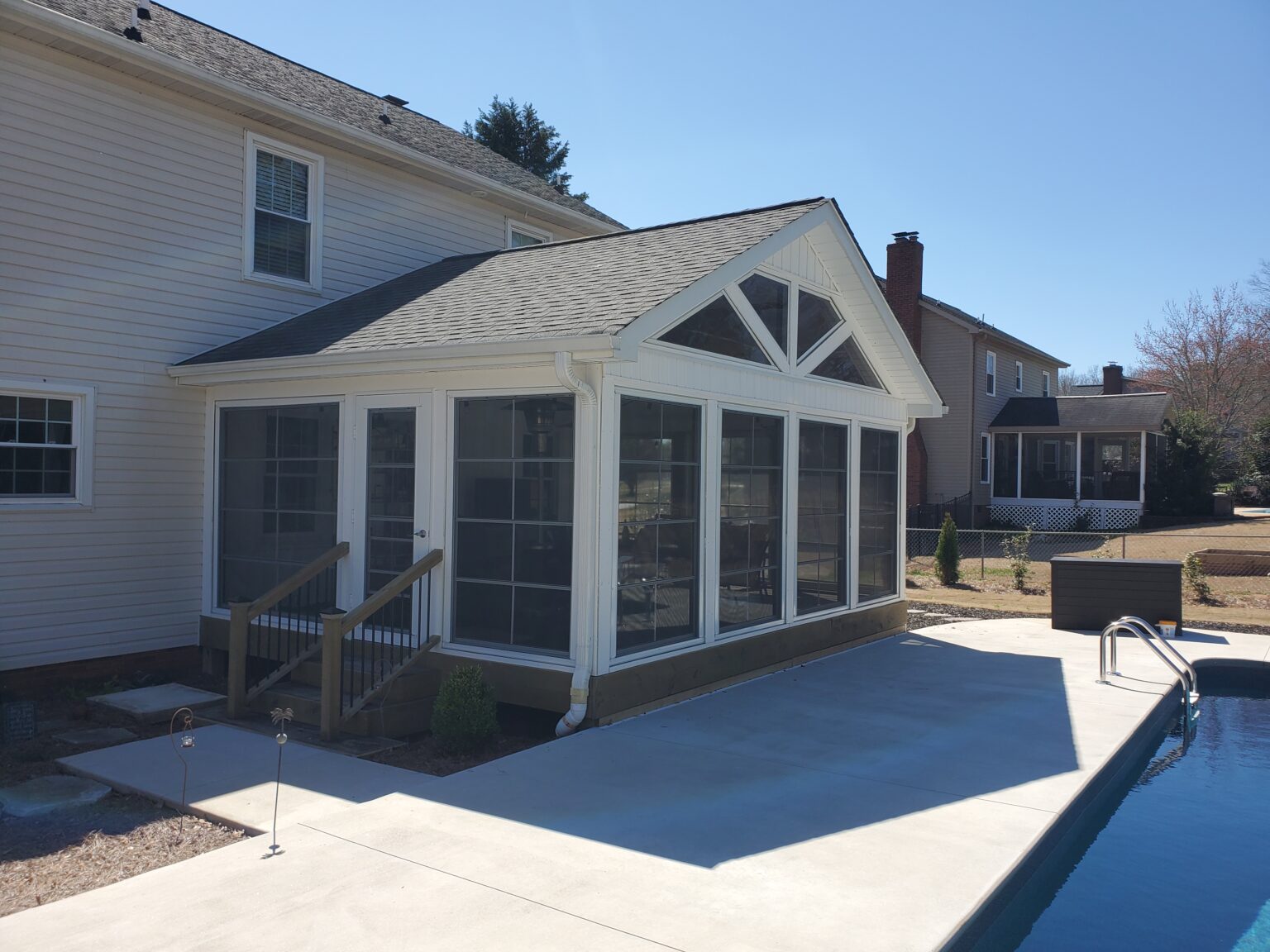 raised three-season room with stairs built by southern comfort exteriors