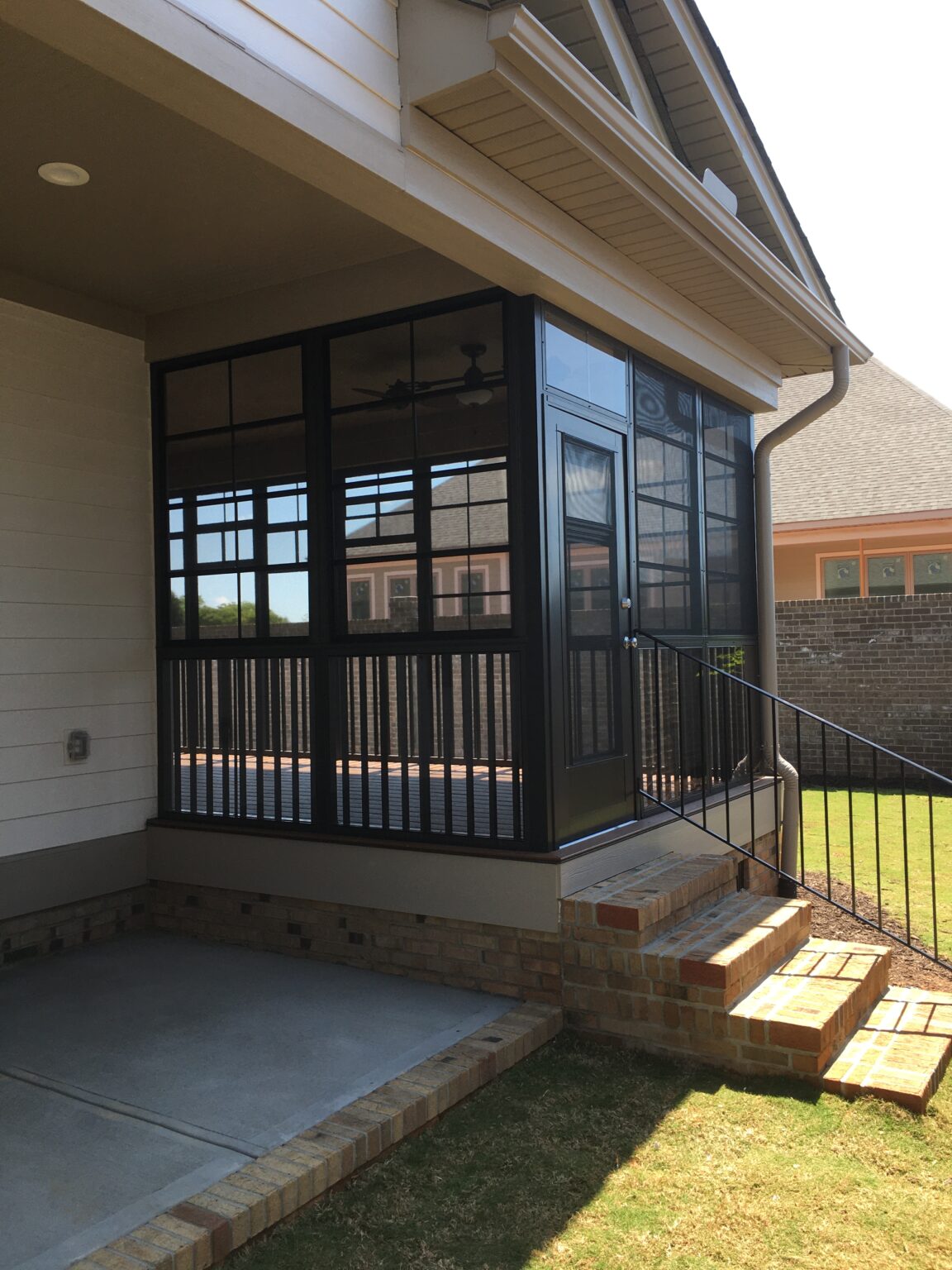 brick stairs leading up to three-season room
